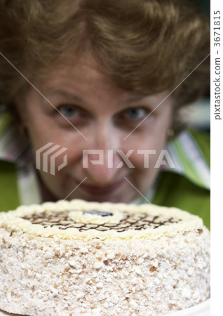 woman with fancy cake(focus on the pie) 3671815