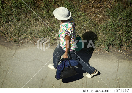 lady with carrier bags(focus on the hat,special photo f/x) 3671967