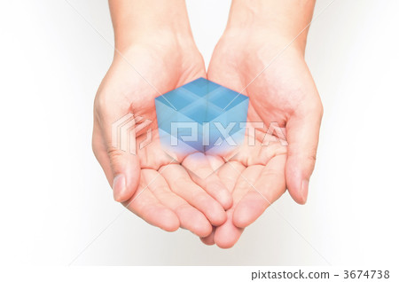 A man supporting a blue cube with both hands. A man supporting a blue cube with both hands. 3674738