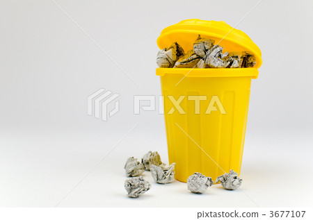 Waste paper overflowing from the trash can 3677107