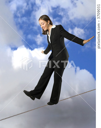 business woman balancing on rope business woman balancing on rope 3709031