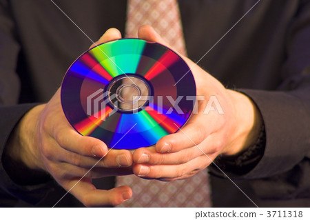 business hand holding CD 3711318