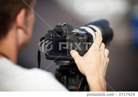 Photographer with Telephoto Lens 3717429