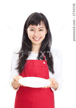 A woman holding a dish 3734156