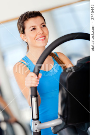 Girl exercising at the gym Girl exercising at the gym 3746445