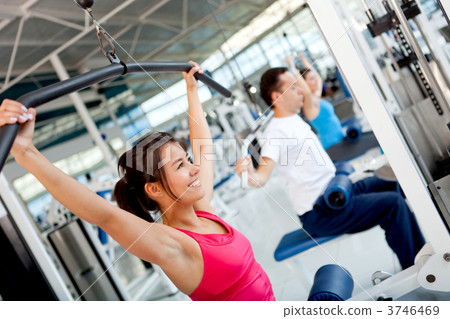 Woman exercising at the gym 3746469