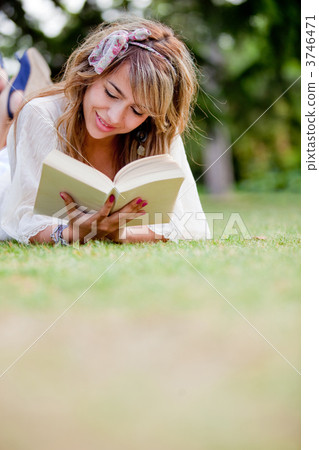 Woman reading outdoors Woman reading outdoors 3746471