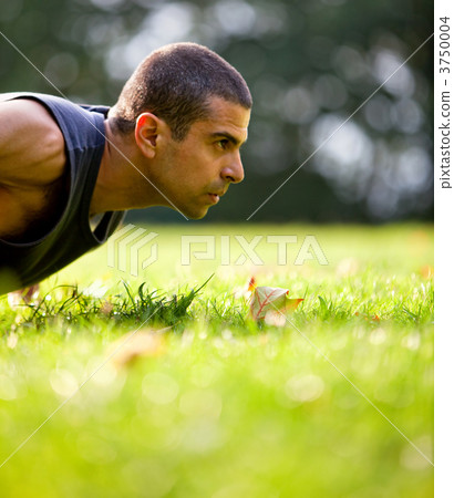 Man exercising outdoors 3750004