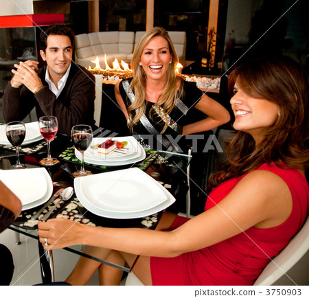 Friends having dinner Friends having dinner 3750903