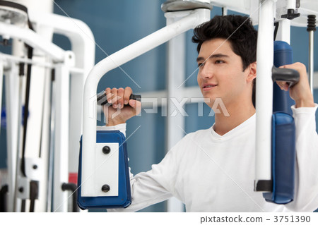 Man at the gym exercising Man at the gym exercising 3751390
