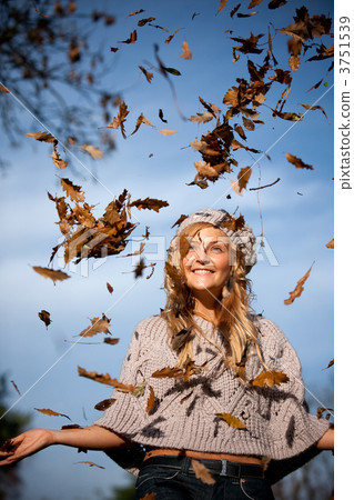 Autumn woman with leaves falling 3751539