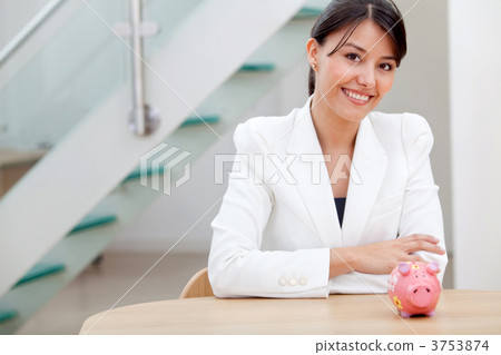 Business woman with a piggybank Business woman with a piggybank 3753874