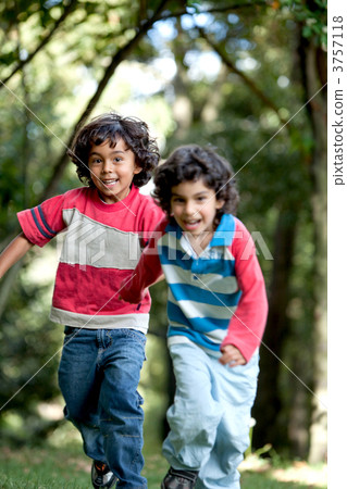 Kids running outdoors Kids running outdoors 3757118
