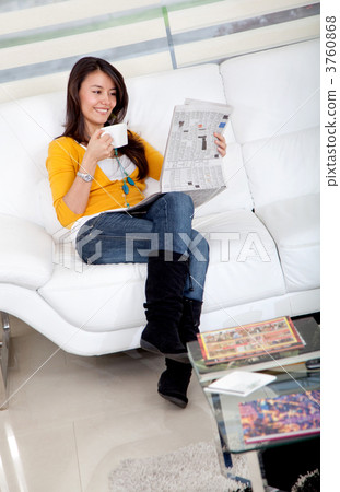 Woman reading the newspaper Woman reading the newspaper 3760868