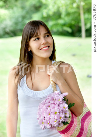 Girl carrying flowers Girl carrying flowers 3765970