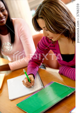 Female student writing 3766359