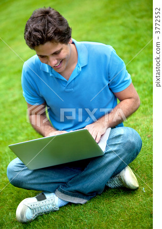 Man with a laptop outdoors 3772552
