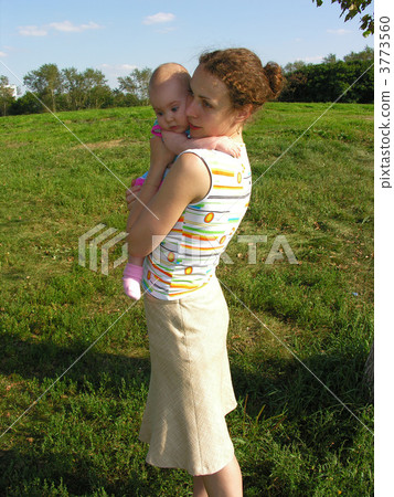 mother with baby on meadow mother with baby on meadow 3773560