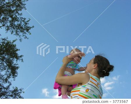 mother with baby and plane in sky 3773567