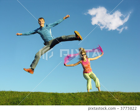 couple jump under cloud 3773822