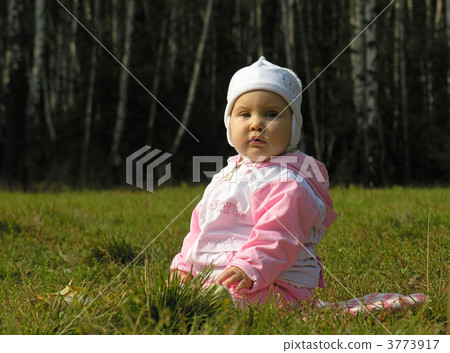 baby sit on grass in jacket and hat 3773917