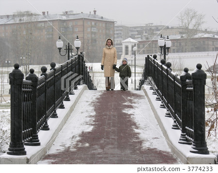 mother with son on winter bridge mother with son on winter bridge 3774233