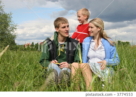 family on meadow waiting next child 3774553