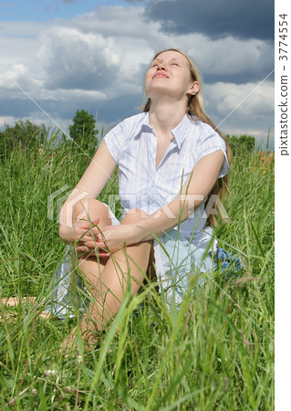 woman sit on grass after storm 3774554