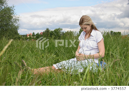 pregnant girl on meadow 2 3774557