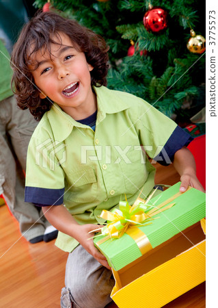 kid opening a gift kid opening a gift 3775573