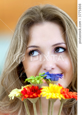 Pensive woman with flowers Pensive woman with flowers 3775808