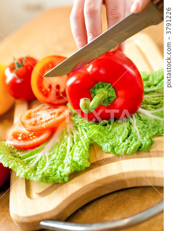 Woman's hands cutting vegetables 3791226