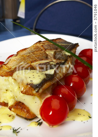 Fish with tomatoes and a potato 3791846