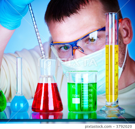 scientist in laboratory with test tubes 3792020