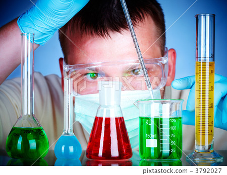 scientist in laboratory with test tubes 3792027