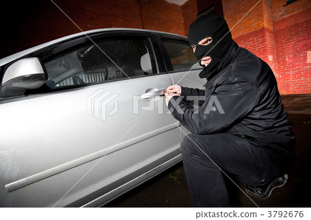 robber and the thief in a mask hijacks the car robber and the thief in a mask hijacks the car 3792676