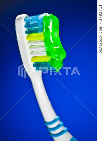 toothbrush on a dark blue background 3792711