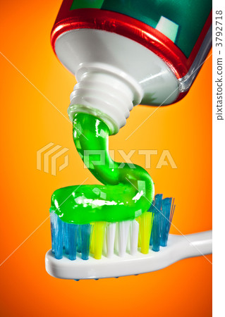 toothpaste being squeezed onto a toothbrush 3792718