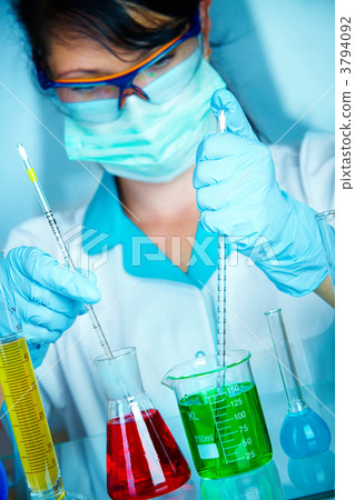 scientist in laboratory with test tubes 3794092