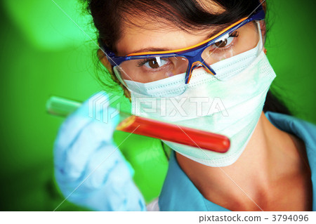 scientist in laboratory with test tubes 3794096