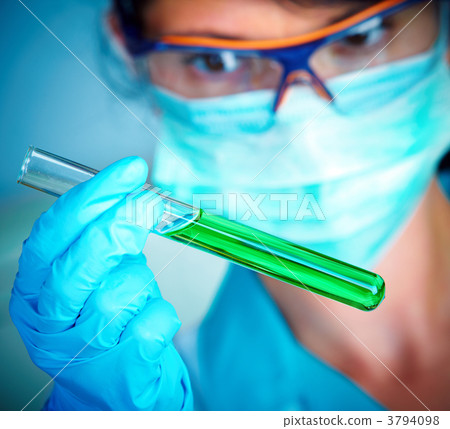 scientist in laboratory with test tubes 3794098