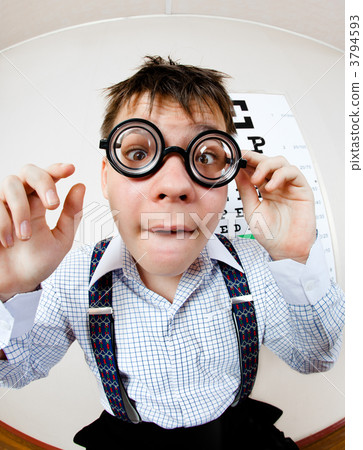 person wearing spectacles in an office at the doctor 3794593