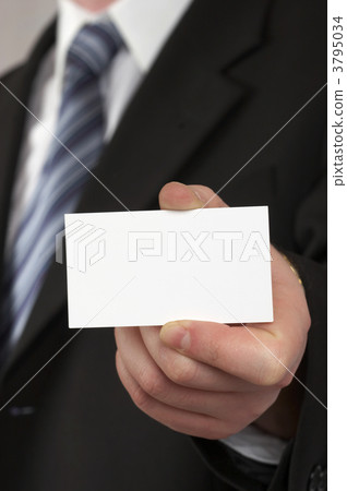 The businessman in a suit and a tie. Hand with a white card . 3795034
