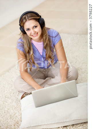 Woman downloading music Woman downloading music 3798227