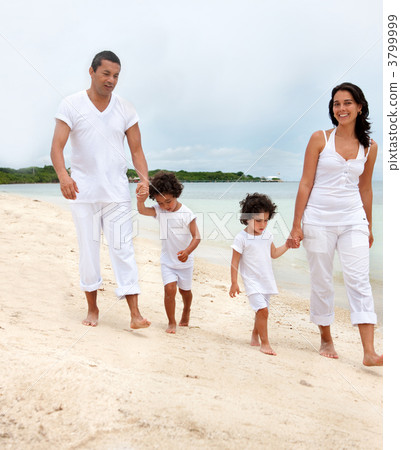 Family walk on the beach 3799999