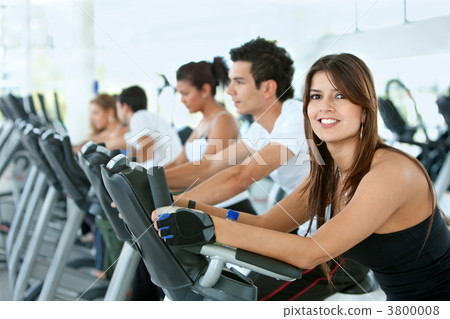 Gym people on cardio machines 3800008
