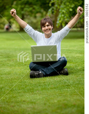 Happy young man with laptop Happy young man with laptop 3801552