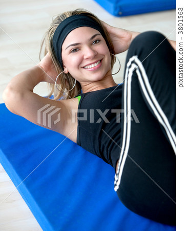 Woman doing abdominals Woman doing abdominals 3801568