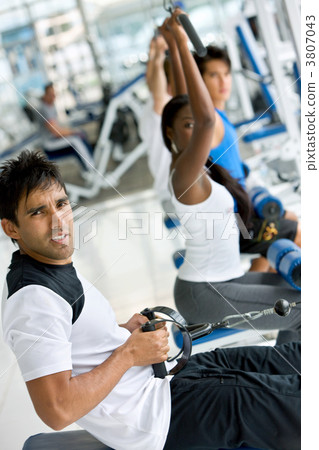 People exercising at the gym 3807043