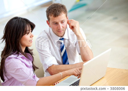 Business couple on a laptop 3808006